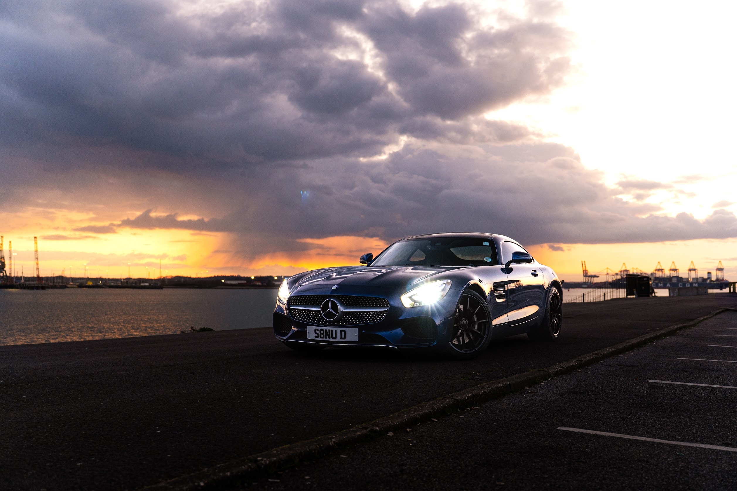 Mansukh's Mercedes photographed beside the water at sunset